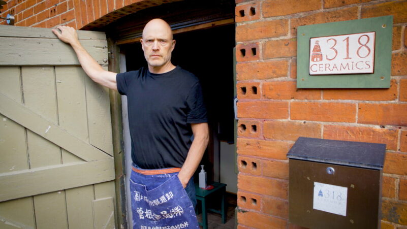 Male standing in a doorway