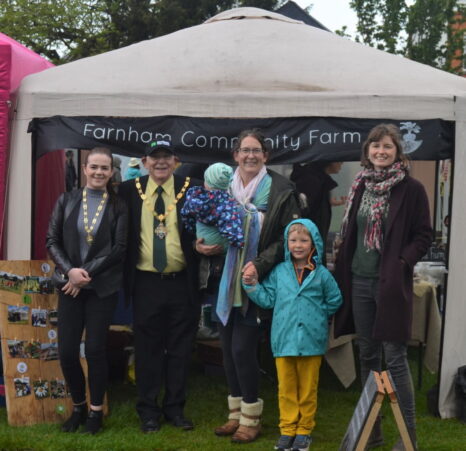 Group of people in front of small marquee