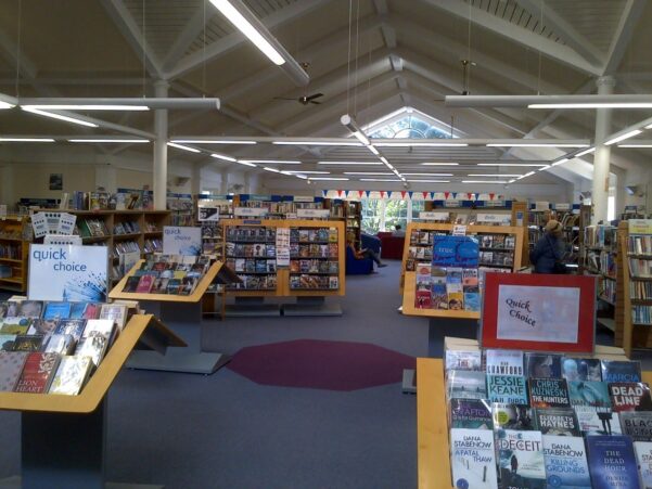 Inside of a library with books on display and on shelves