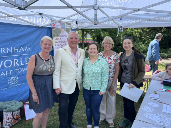 Mayor and Mayoress standing under a gazebo with three other people.