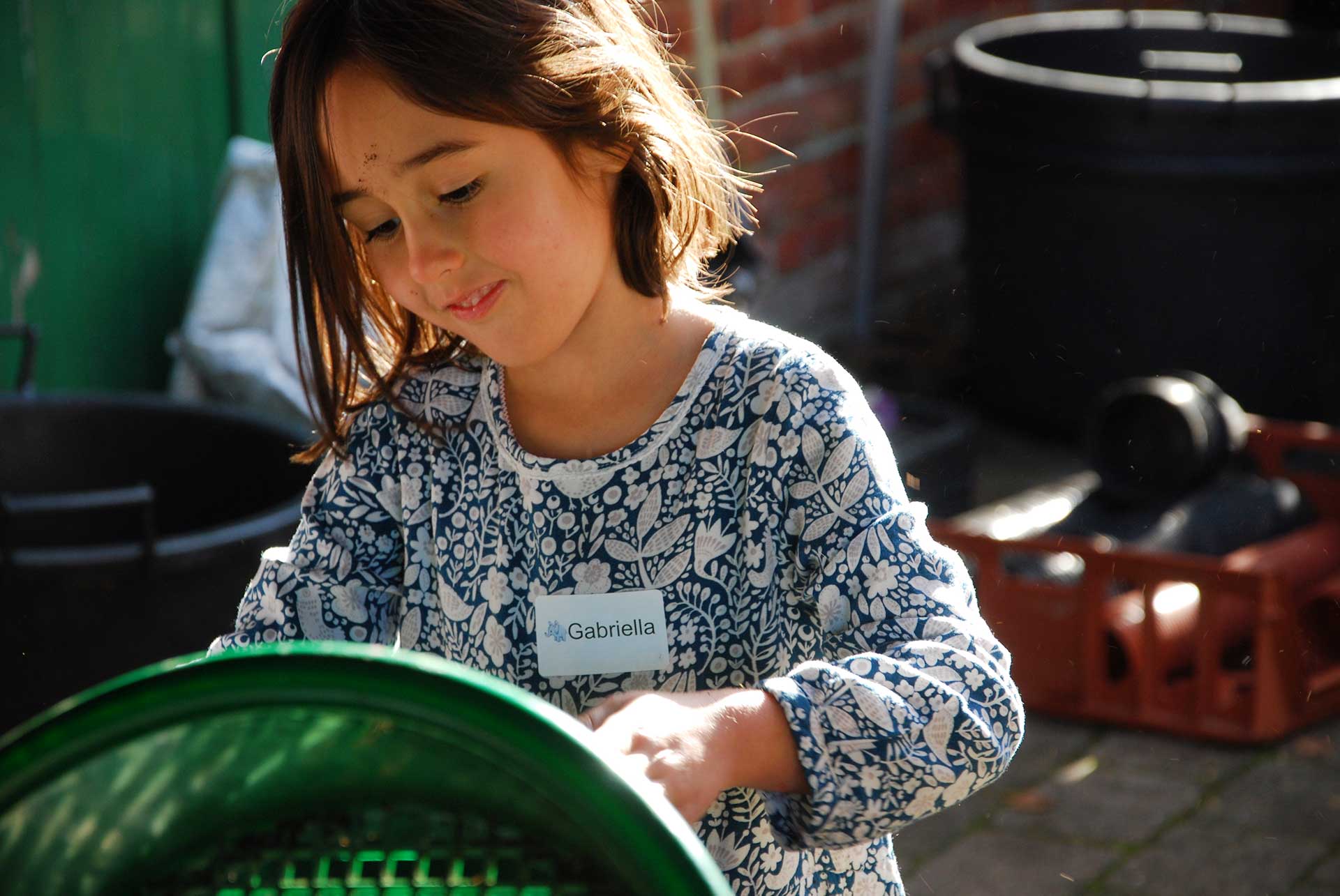 Bloomin Kids Emptying A Pot